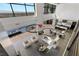 Aerial view of an open living space with a modern kitchen, dining area, living room, and an outdoor pool at 9 Boulderback Dr, Henderson, NV 89012