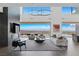 Modern living room with soaring ceilings, city views, and open floor plan at 9 Boulderback Dr, Henderson, NV 89012