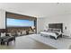 Spacious main bedroom with a private balcony and stunning city and mountain views at 9 Boulderback Dr, Henderson, NV 89012