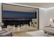 Chic main bedroom with terrace seating, stunning city view and sophisticated decor at 9 Boulderback Dr, Henderson, NV 89012