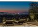 Enjoy lounging on the patio with scenic Las Vegas Strip views and manicured landscaping at 9 Boulderback Dr, Henderson, NV 89012