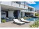 Inviting pool area with sleek lounge chairs and contemporary architecture, perfect for outdoor relaxation and entertaining at 9 Boulderback Dr, Henderson, NV 89012