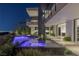 Backyard featuring a modern pool, spa, desert landscaping, and views of the city lights at 9 Boulderback Dr, Henderson, NV 89012