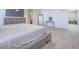 Bedroom features a large bed and desk area with view into home gym at 10279 Fragrant Apple Ct, Las Vegas, NV 89141