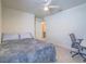 Cozy bedroom with a plush bed and a view of the ensuite bathroom, plus desk area at 10279 Fragrant Apple Ct, Las Vegas, NV 89141
