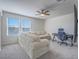 Comfortable bonus room perfect for gaming or relaxing, featuring a sofa and desk setup at 10279 Fragrant Apple Ct, Las Vegas, NV 89141