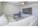 Cozy bonus room featuring a comfortable sectional sofa and a desk for work or play at 10279 Fragrant Apple Ct, Las Vegas, NV 89141