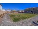Landscaped community area with picnic tables, BBQ grills, and green space for outdoor enjoyment at 10279 Fragrant Apple Ct, Las Vegas, NV 89141