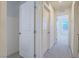 Hallway view shows a clean, carpeted area with white doors and trim at 10279 Fragrant Apple Ct, Las Vegas, NV 89141