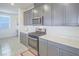 Close up of updated kitchen featuring modern appliances, ample storage, and beautiful countertops at 10279 Fragrant Apple Ct, Las Vegas, NV 89141