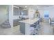 Well-equipped kitchen with an island and barstool seating, stainless steel appliances, and ample counter space at 10279 Fragrant Apple Ct, Las Vegas, NV 89141