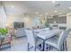 Open concept living space with a modern kitchen, dining area, and cozy living room, perfect for entertaining at 10279 Fragrant Apple Ct, Las Vegas, NV 89141