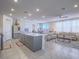 Open floor plan combining kitchen, living, and dining areas for easy entertaining and Gathering life at 10279 Fragrant Apple Ct, Las Vegas, NV 89141