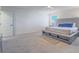 Large, airy main bedroom featuring neutral decor and a seating bench at 10279 Fragrant Apple Ct, Las Vegas, NV 89141