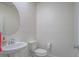 Modern powder room with a pedestal sink and contemporary fixtures at 10279 Fragrant Apple Ct, Las Vegas, NV 89141
