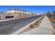 Saguaro Ranch community entrance with tidy landscaping and neighborhood street view at 10279 Fragrant Apple Ct, Las Vegas, NV 89141