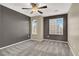 Carpeted bedroom with large windows and modern ceiling fan at 10802 Galveston Bay St, Las Vegas, NV 89179