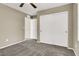 Carpeted bedroom with ceiling fan, closet, and natural light from windows at 10802 Galveston Bay St, Las Vegas, NV 89179