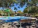 Community splash pad featuring colorful play structures, a covered picnic area, and a shaded bench at 10802 Galveston Bay St, Las Vegas, NV 89179