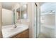 A half bathroom with a single sink vanity and an adjacent closet and bedroom at 1152 Gecko Rd, Henderson, NV 89002