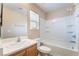 Bright bathroom featuring a shower-tub combo and a large mirror above the sink at 1152 Gecko Rd, Henderson, NV 89002