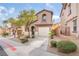 Charming two-story townhouse with a private garage, well-kept landscaping, and inviting curb appeal at 1152 Gecko Rd, Henderson, NV 89002