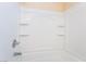 The bright shower features built in shelving and modern fixtures at 1152 Gecko Rd, Henderson, NV 89002