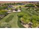 Aerial view of community landscaping with lush green space and desert vegetation at 1407 Wheelwright Ct, Mesquite, NV 89034