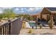 Backyard pool area with desert landscaping and a fenced perimeter at 1407 Wheelwright Ct, Mesquite, NV 89034