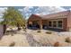 Scenic backyard with desert landscaping, rocks, covered patio and desert views at 1407 Wheelwright Ct, Mesquite, NV 89034