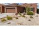 Charming single story home with low maintenance desert landscaping and a two car garage at 1407 Wheelwright Ct, Mesquite, NV 89034