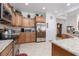 Well-equipped kitchen with stainless steel appliances, granite countertops, and ample storage at 1407 Wheelwright Ct, Mesquite, NV 89034