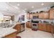 Modern kitchen with stainless steel appliances, granite countertops, and a view of the backyard at 1407 Wheelwright Ct, Mesquite, NV 89034
