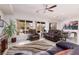 Spacious living room with comfortable seating, a large window, and a view of the backyard at 1407 Wheelwright Ct, Mesquite, NV 89034