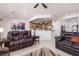 Open concept living room featuring comfortable seating and easy access to the kitchen at 1407 Wheelwright Ct, Mesquite, NV 89034