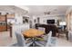 Open concept living and dining area with comfortable seating and easy access to the kitchen at 1407 Wheelwright Ct, Mesquite, NV 89034