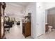 Open living area with tile flooring, stylish furnishings, and seamless access to the bathroom at 1407 Wheelwright Ct, Mesquite, NV 89034