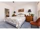 Bright bedroom featuring soft lighting, floral bedding, and ample closet space at 1407 Wheelwright Ct, Mesquite, NV 89034