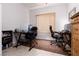 Home office with tile flooring, natural light, and two workstations for remote work at 1407 Wheelwright Ct, Mesquite, NV 89034