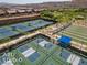 Aerial view of tennis and bocce ball courts in a desert community setting at 1407 Wheelwright Ct, Mesquite, NV 89034
