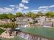 Scenic multi-tiered water feature at Sun City Mesquite, surrounded by lush greenery at 1407 Wheelwright Ct, Mesquite, NV 89034