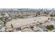 Expansive aerial view showcasing horse property with multiple riding arenas in a residential neighborhood at 1462 Rawhide St, Las Vegas, NV 89119