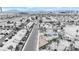 Monochrome aerial view of neighborhood with focus on house featuring solar panels and well maintained yard at 1462 Rawhide St, Las Vegas, NV 89119