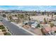 Aerial view highlights home, with solar panels, manicured landscaping, proximity to city, and possible equestrian amenities at 1462 Rawhide St, Las Vegas, NV 89119