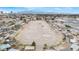 Expansive aerial view showcasing horse property with multiple riding arenas in a residential neighborhood at 1462 Rawhide St, Las Vegas, NV 89119