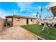 Spacious backyard with artificial grass and a covered area at 1462 Rawhide St, Las Vegas, NV 89119