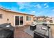 A backyard patio offers a fire pit and outdoor seating, creating an inviting and comfortable space at 1462 Rawhide St, Las Vegas, NV 89119
