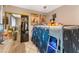 Bedroom view with posters, closet with mirrored door and bunk bed with hanging decorations at 1462 Rawhide St, Las Vegas, NV 89119