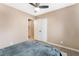 This bedroom has wood floors, a ceiling fan, and closet with folding doors at 1462 Rawhide St, Las Vegas, NV 89119