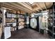 Bonus room with shelving, TV and studio setup; perfect for storage or hobbies at 1462 Rawhide St, Las Vegas, NV 89119